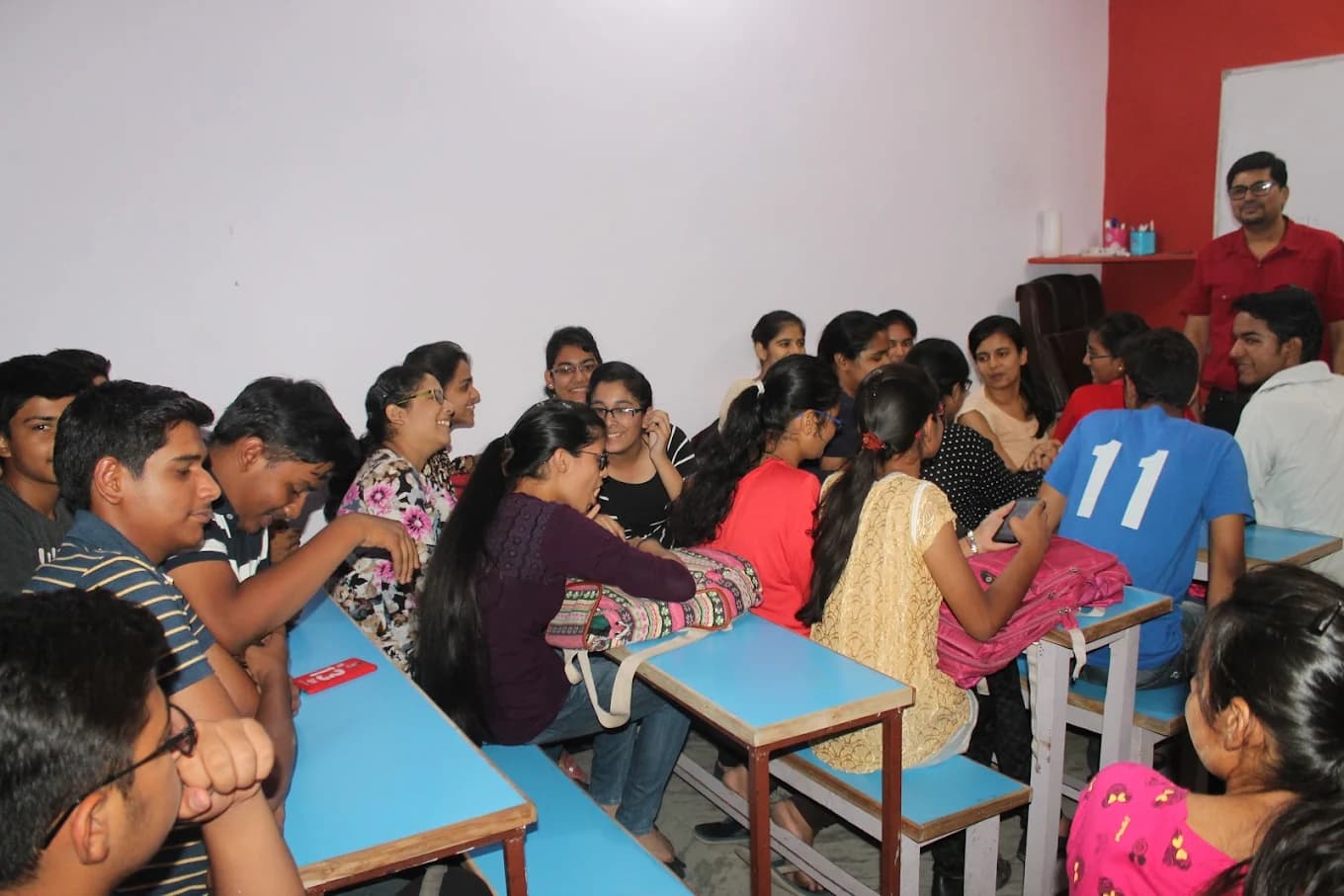 ProNEET classroom in session, students with Neeraj sir at the back of the room